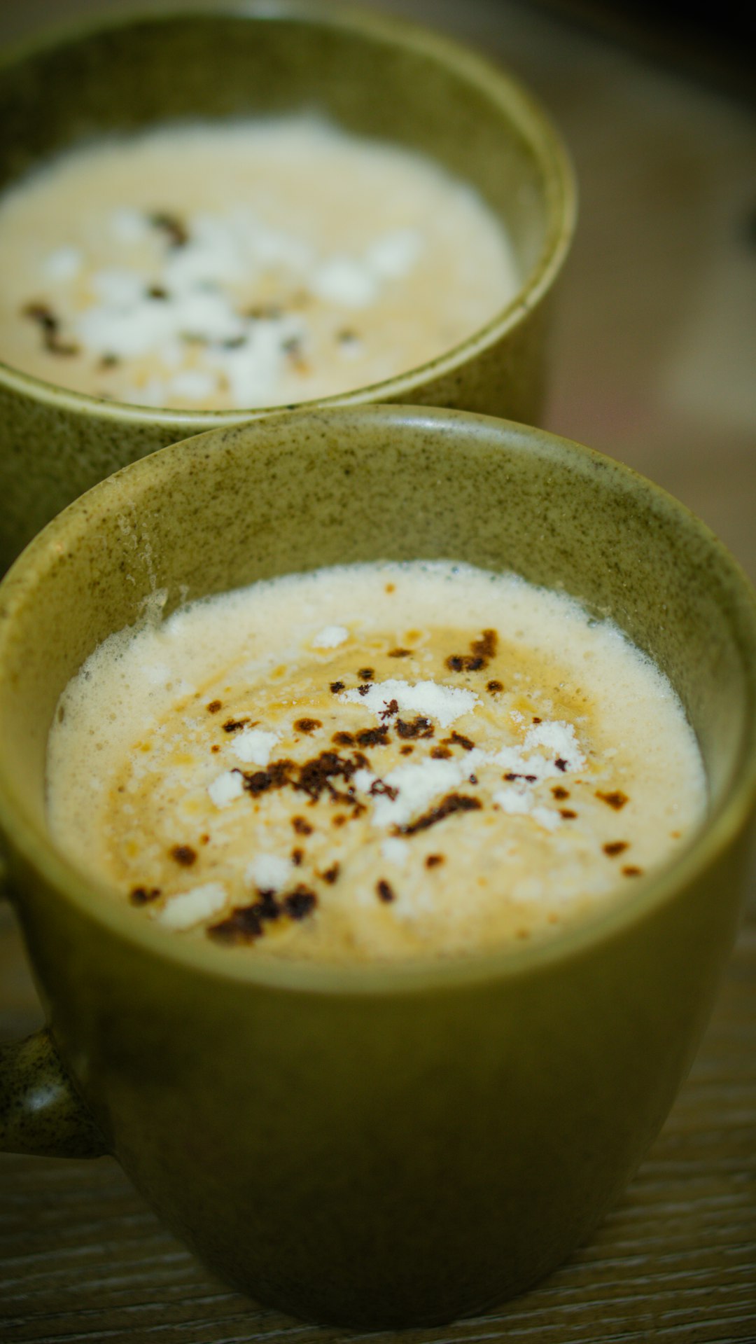 a-couple-of-cups-filled-with-liquid-on-top-of-a-table-p2jd9qm-m2q