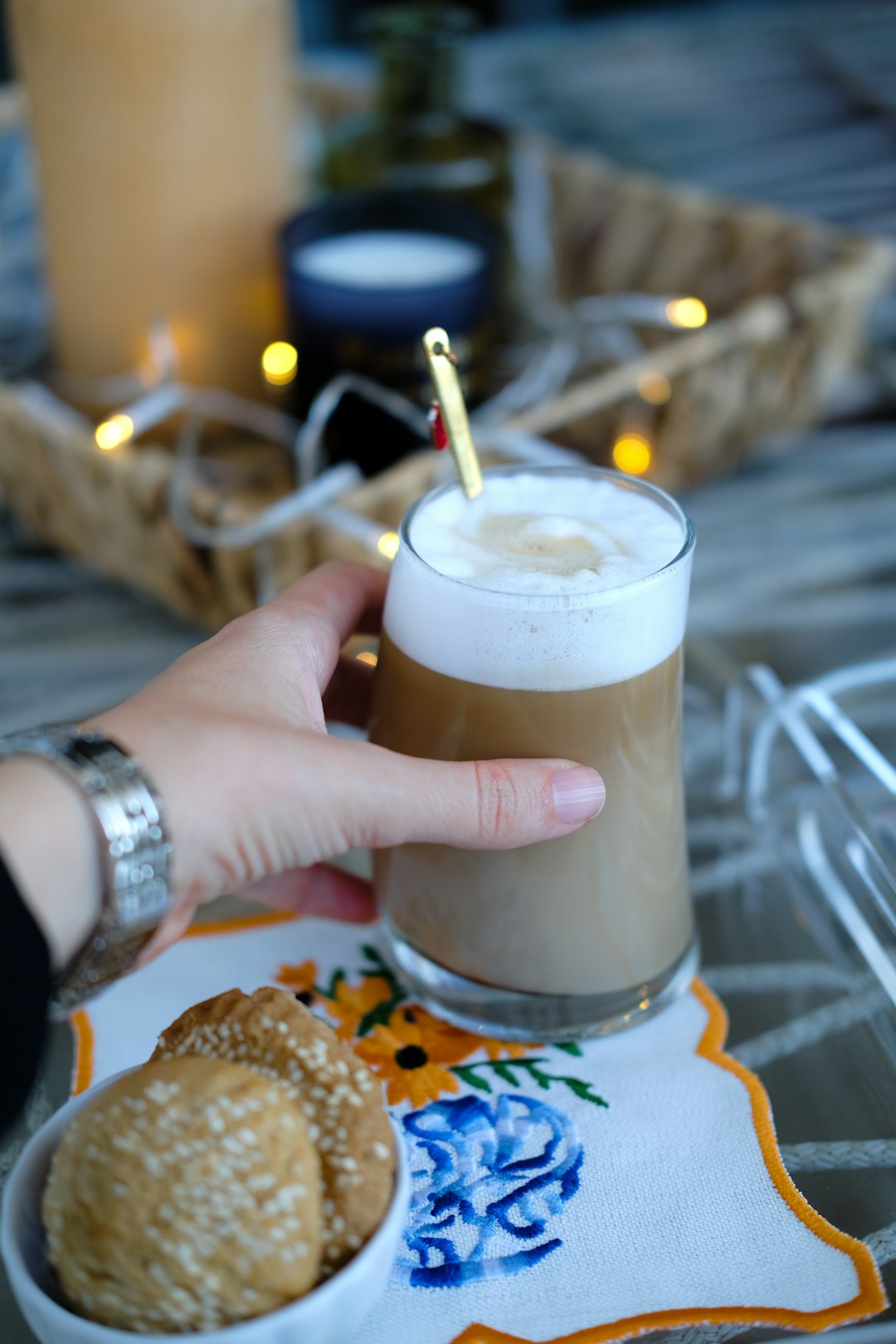 a-person-is-holding-a-drink-and-some-cookies-ye16heorg5m
