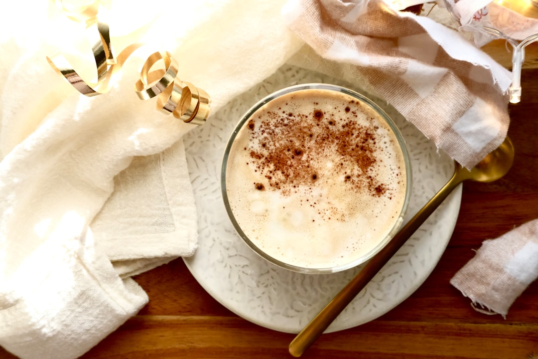 a-close-up-of-a-creamy-beverage-dusted-with-cinnamon-vzclwbzhktg